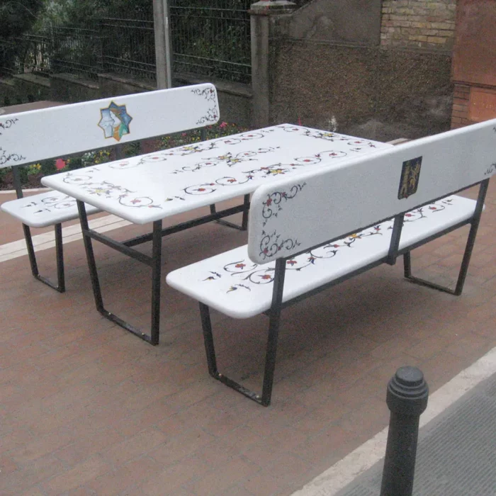 A lava stone set, table, and benches in blooming harmony design. Elevate urban decor with products that can withstand harsh weather conditions.