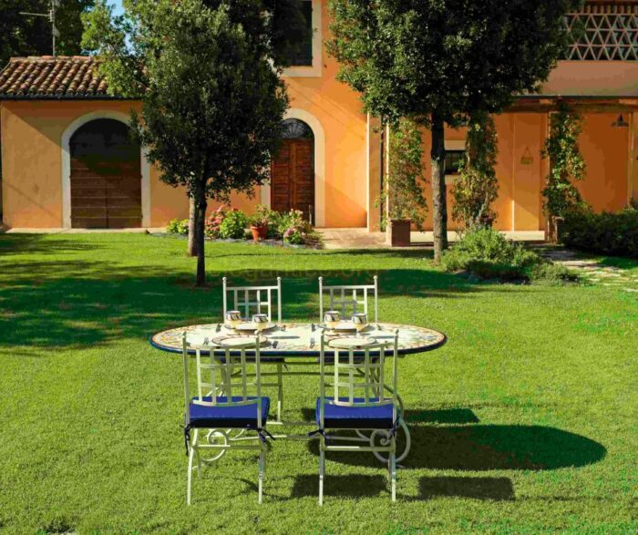 A custom-sized and designed lava stone table. These tables are made in Italy from premium lava stone and hand-painted by our talented artisans.