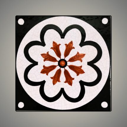 This is an enamel-glazed lava stone tile, hand-painted in Tuscan blossom design.