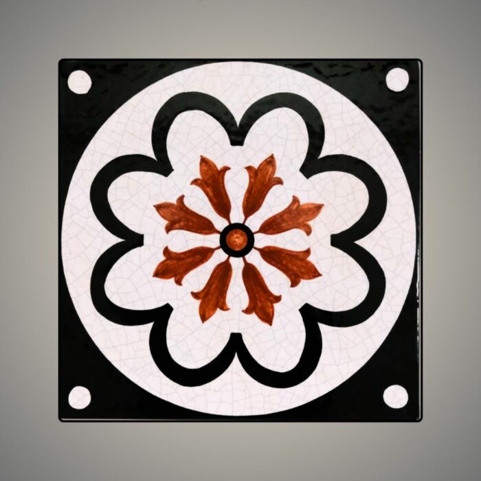This is an enamel-glazed lava stone tile, hand-painted in Tuscan blossom design.